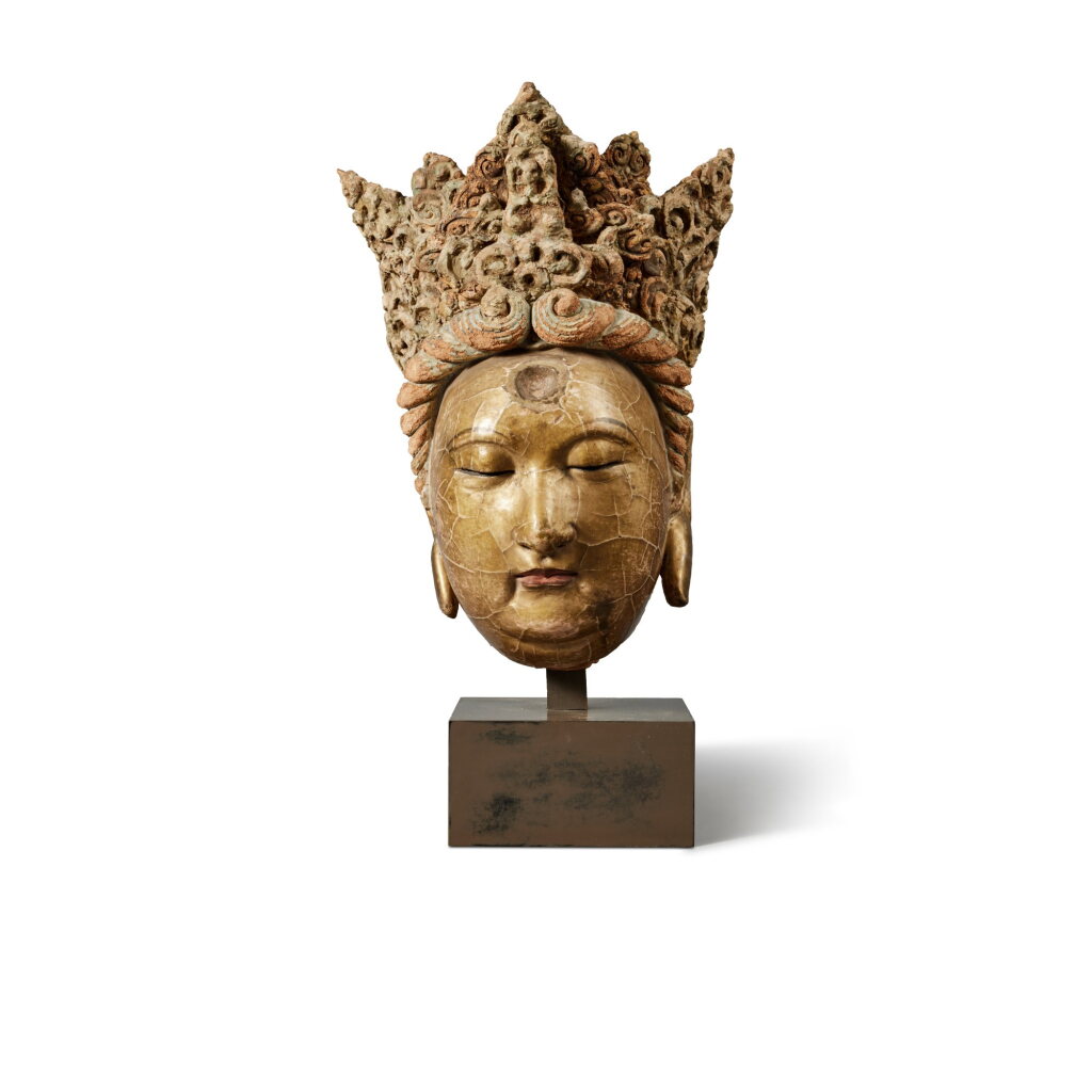 View full screen - View 1 of Lot 267. A polychrome-painted and gilt-lacquered stucco head of a bodhisattva, Yuan / Ming dynasty | 元 / 明 彩繪漆金泥塑菩薩首像.