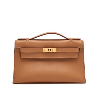 View full screen - View 1 of Lot 402. Biscuit Kelly Pochette in Swift Leather with Gold Hardware, 2010.
