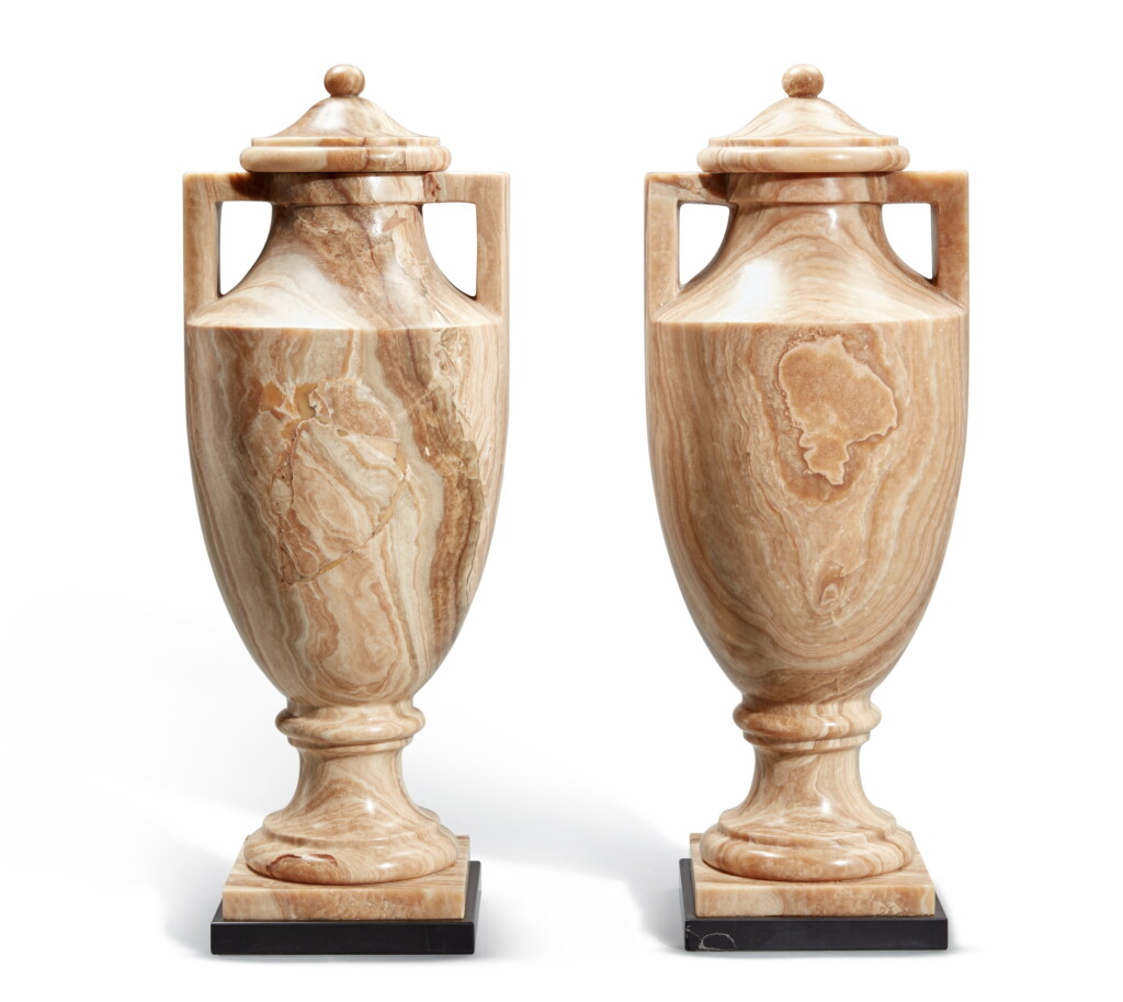 View full screen - View 1 of Lot 9. A Pair of Neoclassical Style Carved Alabaster Lidded Vases, Modern.