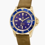 Submariner, Reference 1680 | A yellow gold wristwatch with purple dial and date | Circa 1978