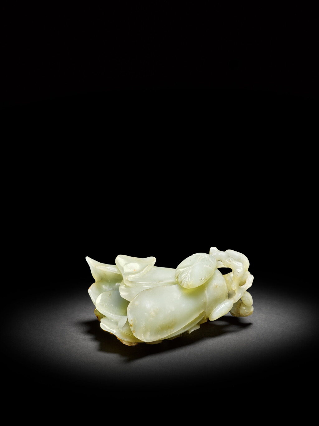 View full screen - View 1 of Lot 6. A celadon jade 'magnolia' carving, Qing dynasty, 18th - 19th century | 清十八至十九世紀 青玉雕玉蘭花式擺件.