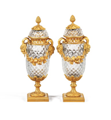 View full screen - View 1 of Lot 130. A pair of Louis XVI style gilt-bronze crystal covered vases, mid 19th century | Paire de vases couverts en cristal taillé et bronze doré de style Louis XVI, milieu du XIXème siècle.