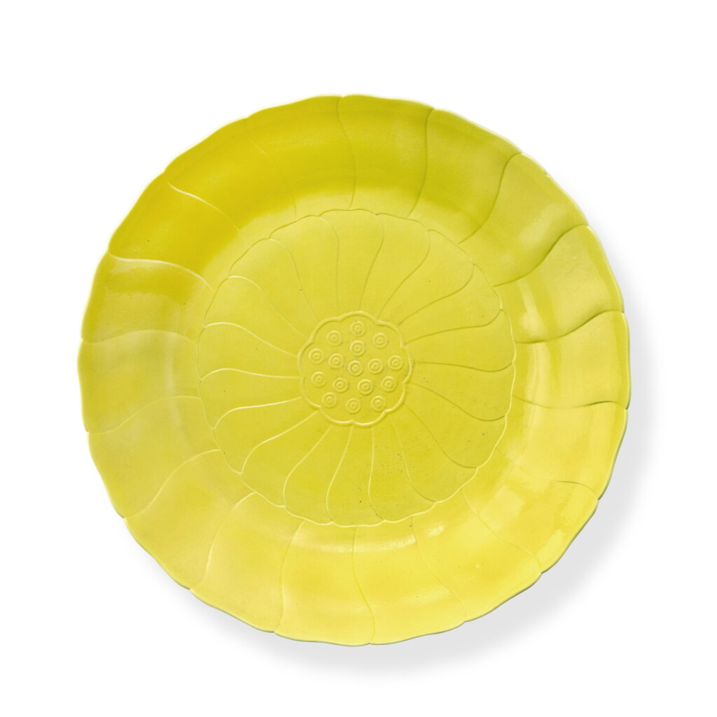 View full screen - View 1 of Lot 73. A rare molded lemon-yellow-enameled 'lotus' dish, Mark and period of Yongzheng | 清雍正 檸檬黃釉蓮花式盤 《大清雍正年製》款.