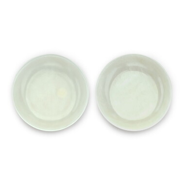 View full screen - View 1 of Lot 48. A pair of white jade saucer dishes Seal marks and period of Jiaqing | 清嘉慶 白玉盤一對 《大清嘉慶年製》款.