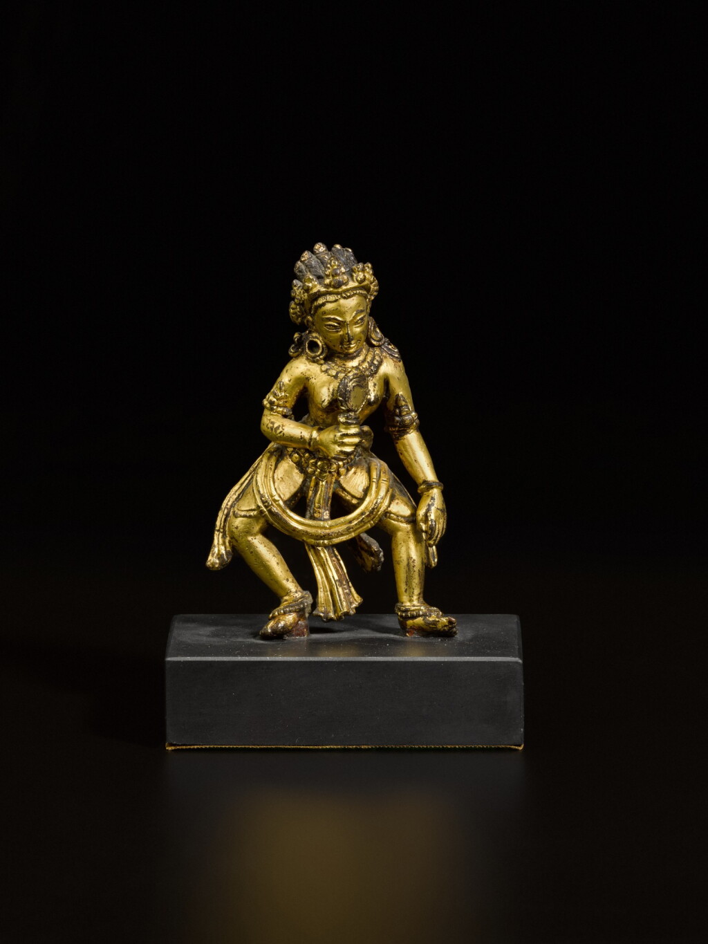 View full screen - View 1 of Lot 44. A small gilt-copper offering goddess Nepal, ca. 14th century | 尼泊爾 約十四世紀 鎏金銅女神立像.