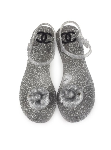 View full screen - View 1 of Lot 82. CHANEL | SILVER JELLY CAMELLIA ANKLE STRAP SANDALS .