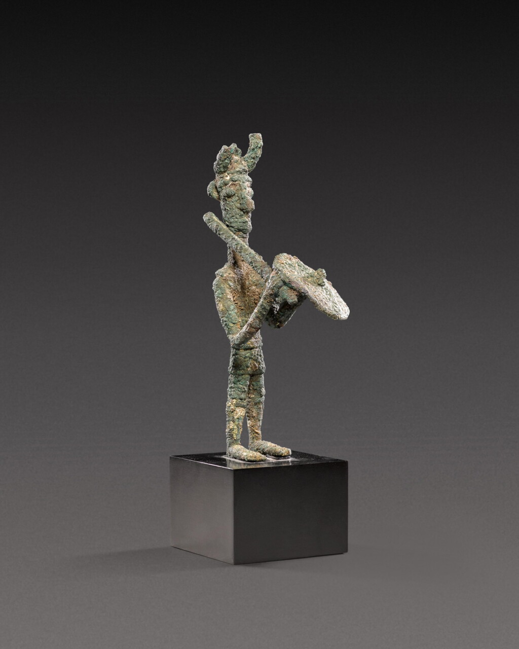 View full screen - View 1 of Lot 102. A Sardinian Bronze Figure of a Warrior, circa 7th/6th century B.C..
