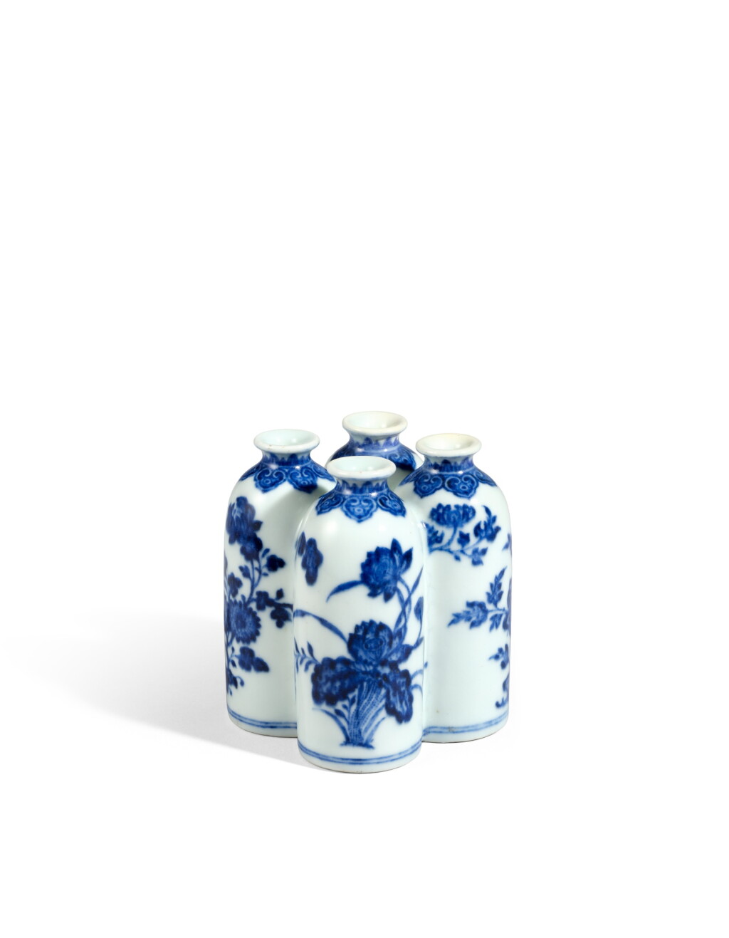 View full screen - View 1 of Lot 6047. A rare blue and white ‘flowers of the four seasons’ conjoined vase, Seal mark and period of Qianlong | 清乾隆 青花四季花卉紋四聯瓶 《乾隆年製》款.