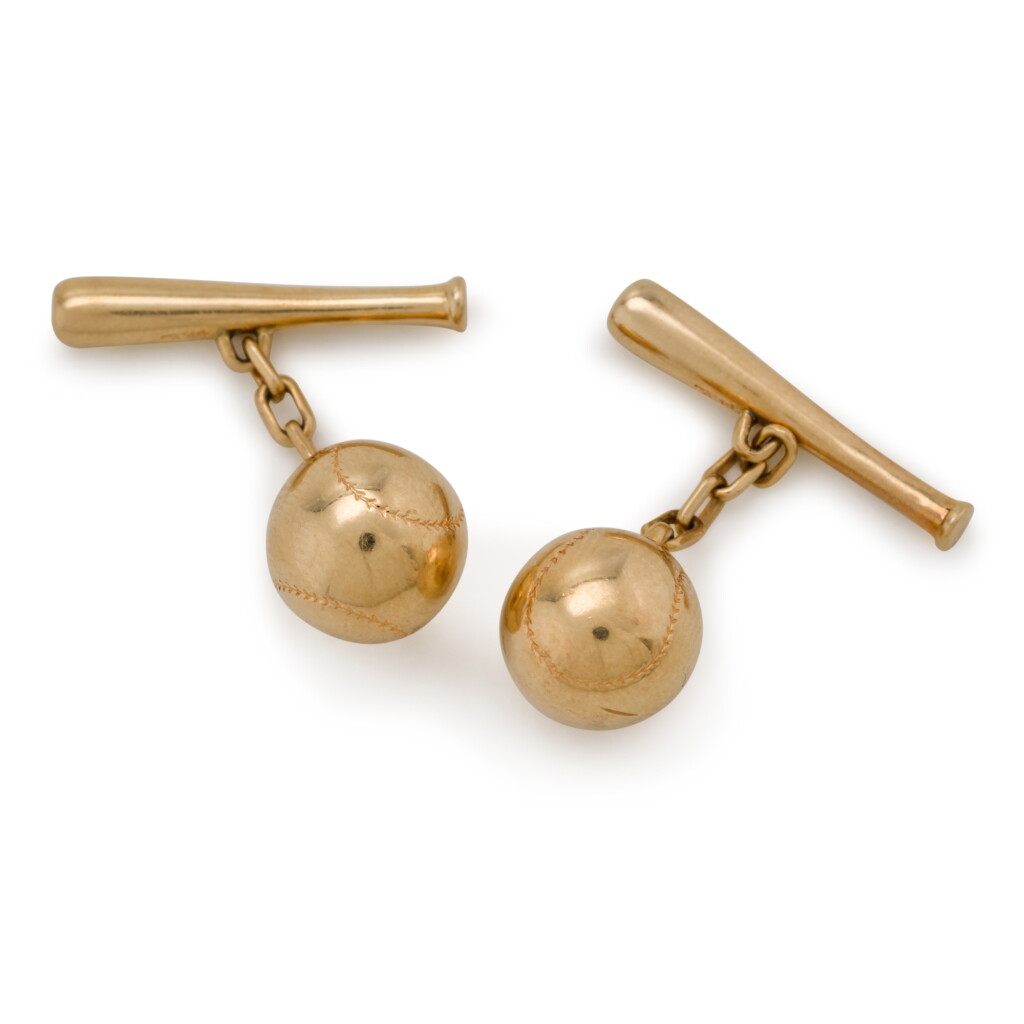 View full screen - View 1 of Lot 78. A pair of gold baseball cufflinks, stamped '14', 20th century.