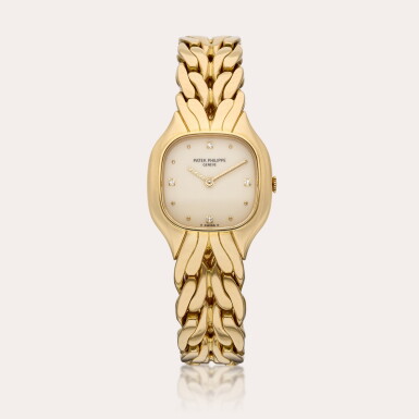 View full screen - View 1 of Lot 514. Reference 4815/1 La Flamme | A yellow gold and diamond-set cushion-shaped wristwatch with bracelet, Circa 1992.