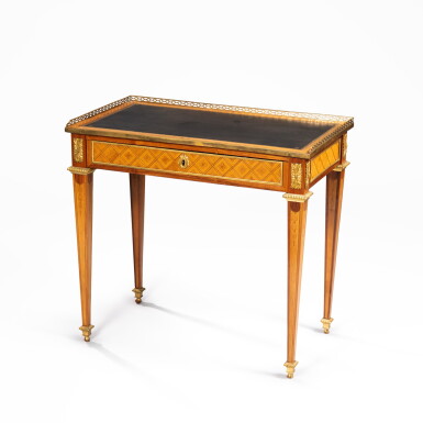 View full screen - View 1 of Lot 53. A Louis XVI gilt-bronze mounted tulipwood and holly marquetry writing table, circa 1780 stamped by Godefroy Dester | Table à écrire en marqueterie de bois de rose et houx et bronze doré d'époque Louis XVI, vers 1780, estampille de Godefroy Dester.