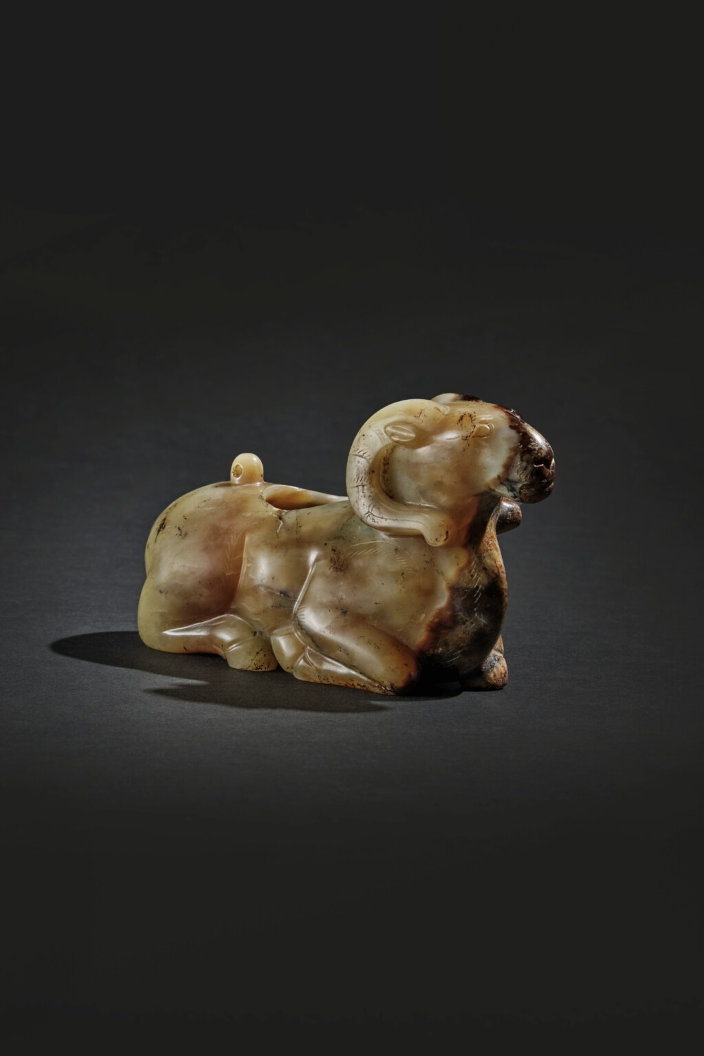 View full screen - View 1 of Lot 45. A large and rare celadon and russet jade ram-form waterpot, Western Han dynasty.