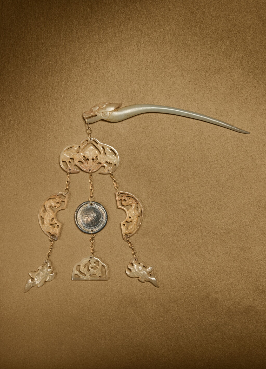 View full screen - View 1 of Lot 123. A pale celadon jade 'dragon' hairpin with reticulated pendants, Liao dynasty.