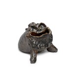 A Martin Brothers stoneware grotesque spoon-warmer, 1881