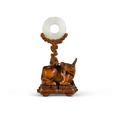 View full screen - View 1 of Lot 117. A small white jade disc, bi, and well-carved boxwood 'xiniu' stand Qing dynasty, 18th century | 清十八世紀 黃楊木雕犀牛望月架及白玉璧.