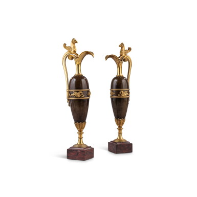 View full screen - View 1 of Lot 672. A pair of French patinated- and gilt-bronze ewers, first half 19th century, after a model by Claude Galle.