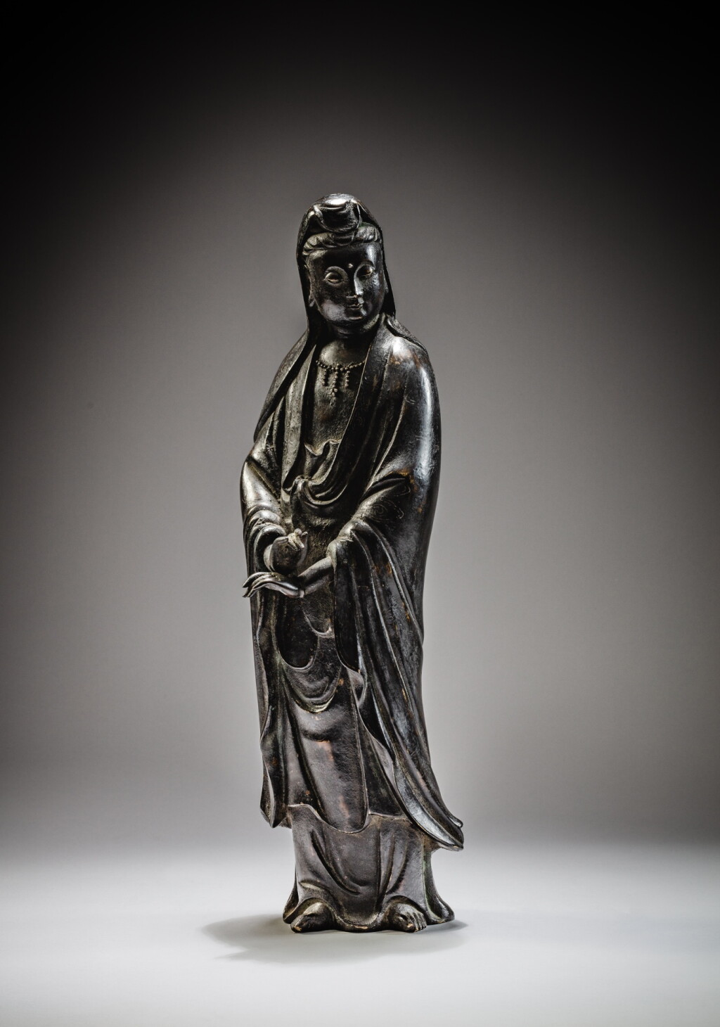 View full screen - View 1 of Lot 110. A large bronze figure of Guanyin, Ming dynasty | 明 銅觀音菩薩立像.