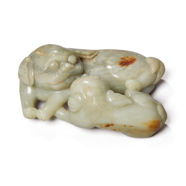 View full screen - View 1 of Lot 1046. A LARGE CELADON AND RUSSET JADE 'BUDDHIST LION' GROUP, QING DYNASTY, 19TH CENTURY.