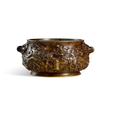 View full screen - View 1 of Lot 3669. A bronze 'dragon' incense burner Ming dynasty, Xuande mark | 明 銅鏨雲龍紋獅耳簋式爐 《大明宣德年製》仿款.