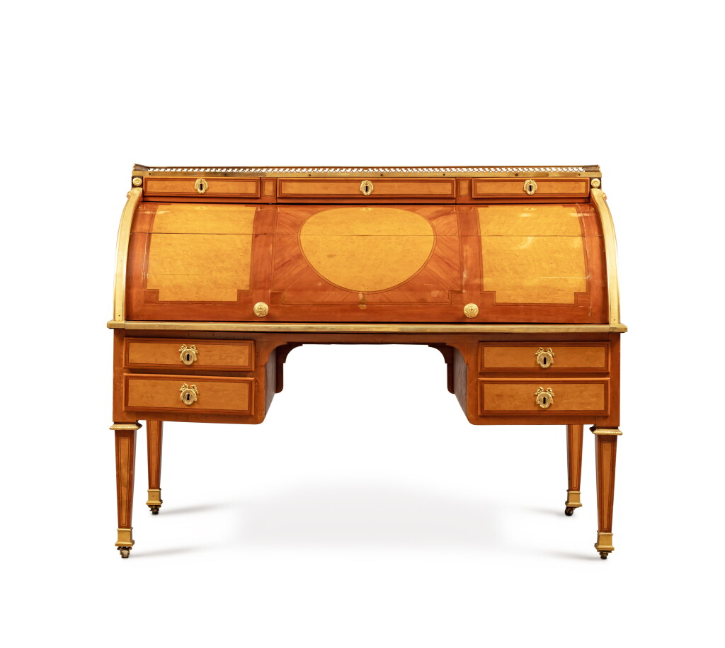 View full screen - View 1 of Lot 102. A Louis XVI gilt-bronze mounted maple veneered, bird's eye maple, tinted holly bureau à cylindre, 1779, by Jean-François Hache.