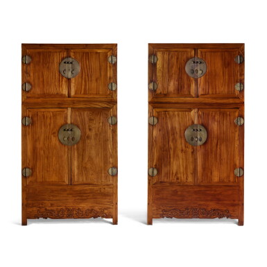 View full screen - View 1 of Lot 137. A pair of 'huali' compound cabinets (Sijiangui), 17th / 18th century | 十七 / 十八世紀 花梨雕雙龍紋四件頂箱櫃成對.