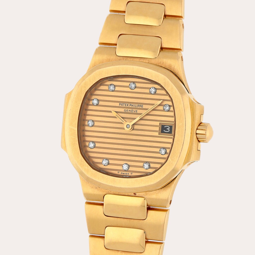 View full screen - View 1 of Lot 235. Nautilus, Reference 4700/1J | A yellow gold and diamond-set wristwatch with date and bracelet | Circa 1987.