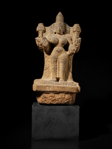 View full screen - View 1 of Lot 159. A large carved granite figure of a female deity, South India, Vijayanagara period, 14th century.