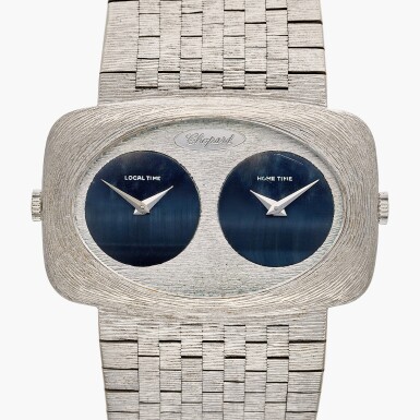 View full screen - View 1 of Lot 662. Reference 2051-1 | A white gold dual time zone bracelet watch with hawk-eye dials, Circa 1970.