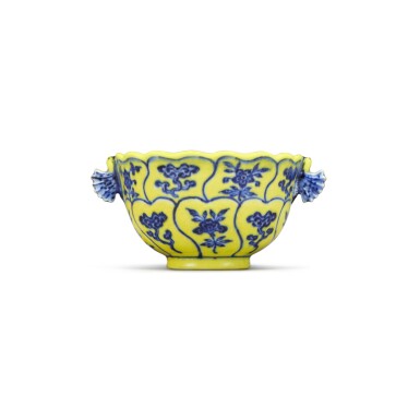 View full screen - View 1 of Lot 515. A fine and rare Ming-style yellow-ground and underglaze-blue handled cup, Mark and period of Yongzheng | 清雍正 黄地青花仙芝花卉紋雙耳盃 《大清雍正年製》款.