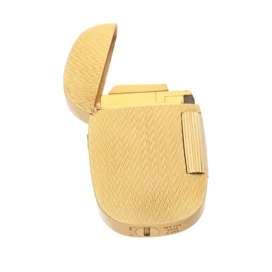 View full screen - View 1 of Lot 54. 'Chevrons' Golden Ellipse lighter, Ref. 9502 A053, Yellow gold lighter Circa 1970 | 百達翡麗 | 9502 A053型號「'Chevrons' Golden Ellipse」黃金打火機,約1970年製.
