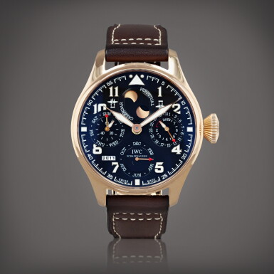View full screen - View 1 of Lot 693. Big Pilot, limited edition 'Antoine de Saint Exupéry', reference 502617 Montre bracelet quantième perpétuel en or rose avec phases de lune et indicateur de réserve de marche | Pink gold perpetual calendar wristwatch with moon phases and power reserve indication Vers 2011 | Circa 2011.