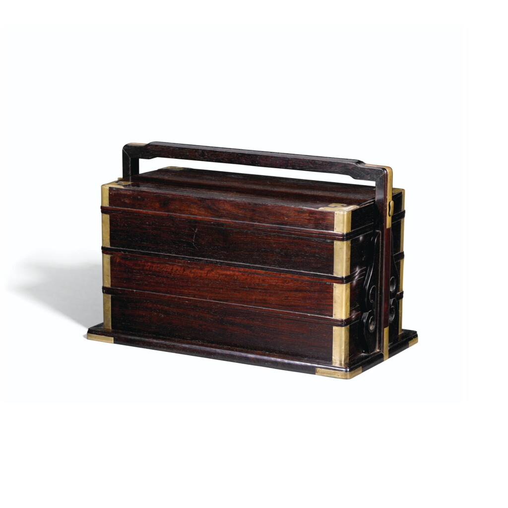 View full screen - View 1 of Lot 115. A ZITAN THREE-TIERED PICNIC BOX, QING DYNASTY, 18TH/19TH CENTURY | 清十八/十九世紀 紫檀三層提盒.