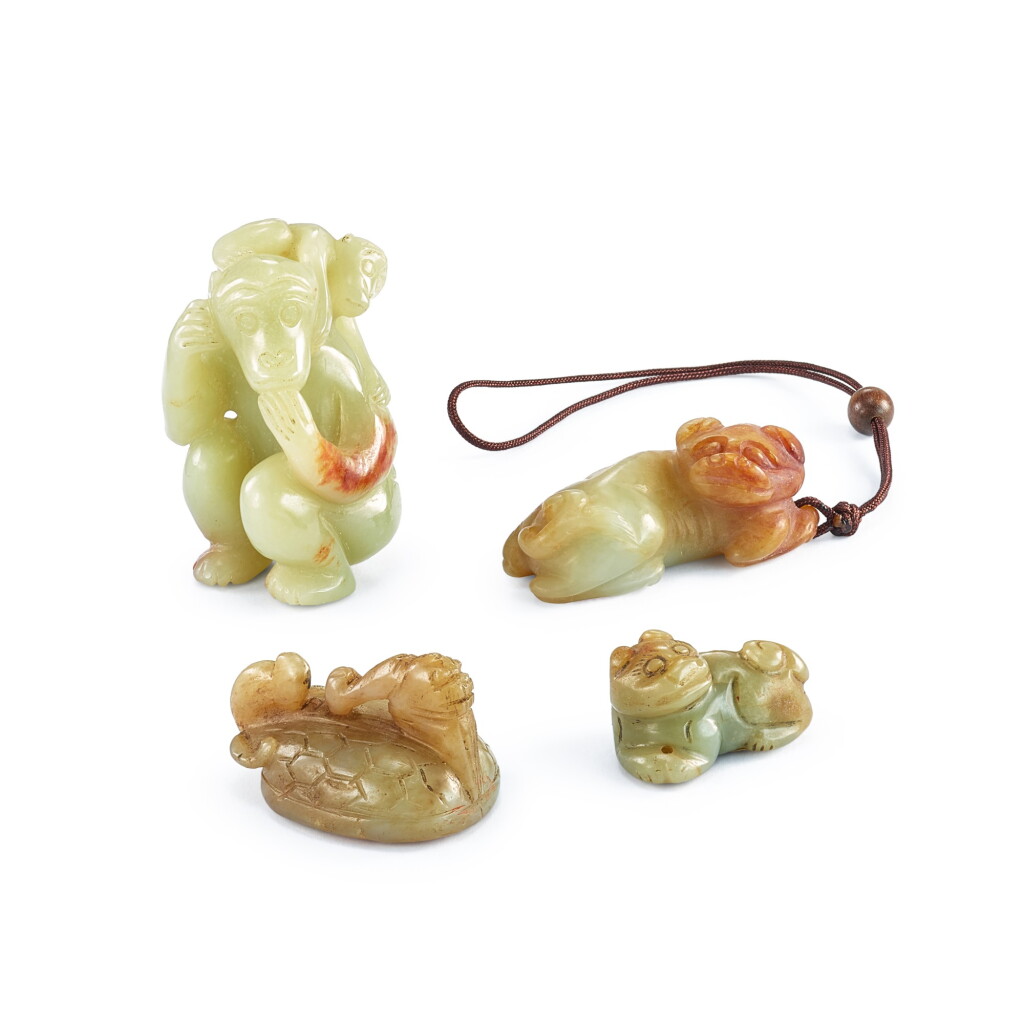 View full screen - View 1 of Lot 2009. Four celadon and russet jade animal carvings, Ming dynasty or later 明或以後 青玉瑞獸一組四件.