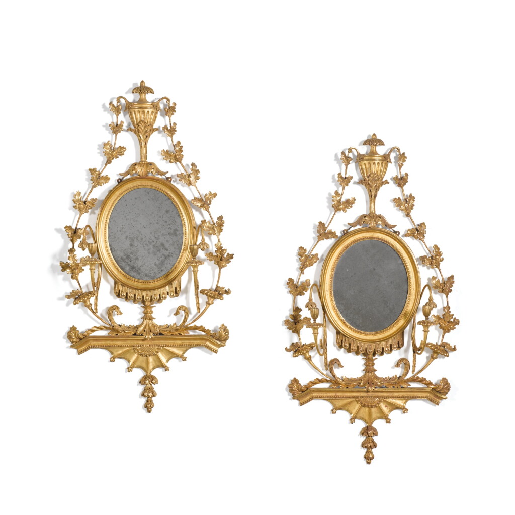 View full screen - View 1 of Lot 101. A pair of George III carved giltwood girandole wall mirrors, circa 1790.