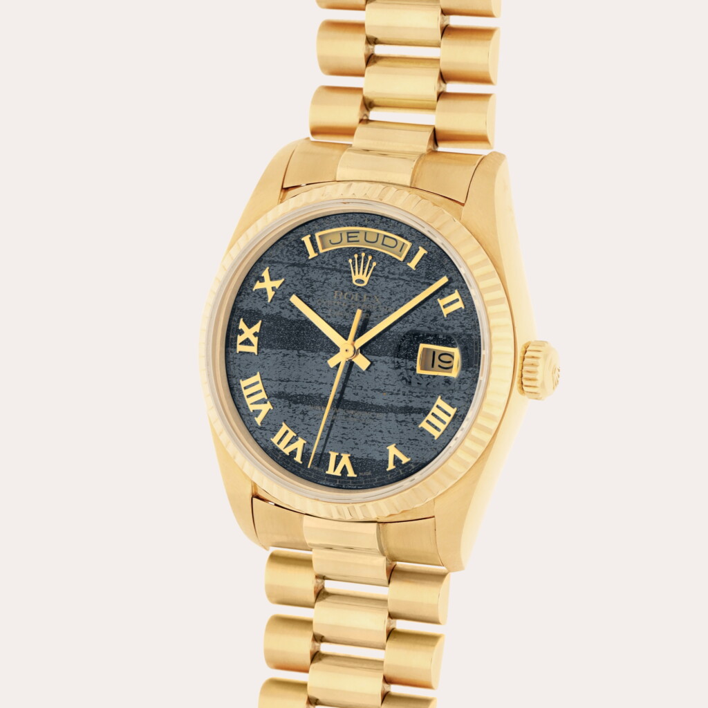 View full screen - View 1 of Lot 78. Day-Date, Reference 18038 | A yellow gold wristwatch with day, date, bracelet and ferrite dial | Circa 1987.