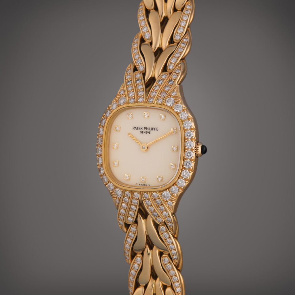 View full screen - View 1 of Lot 399. Reference 4815/3J La Flamme | A yellow gold and diamond-set cushion shaped bracelet watch, Circa 2000.