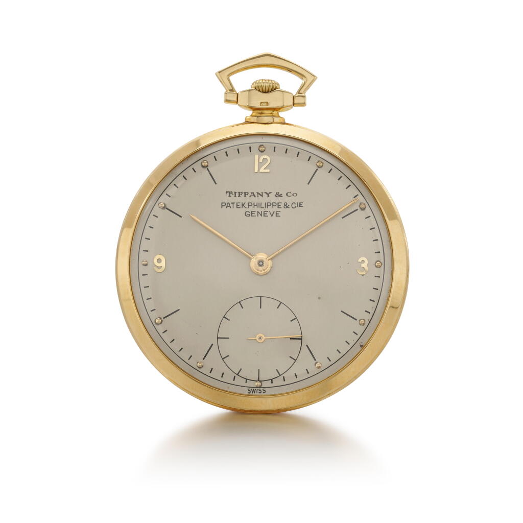 View full screen - View 1 of Lot 75. Patek Philippe yellow gold open-faced ultra thin watch, Tiffany&Co., 1945.