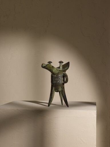 View full screen - View 1 of Lot 203. An inscribed archaic bronze ritual wine vessel, Jue, Late Shang/early Western Zhou dynasty | 商末/西周初 我父己爵.