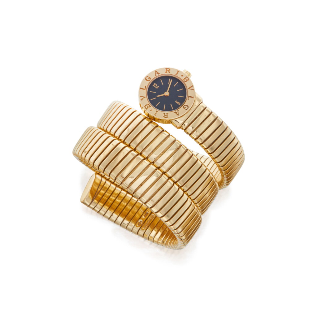 View full screen - View 1 of Lot 22. GOLD 'TUBOGAS' BRACELET-WATCH, BULGARI.