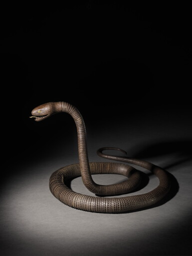 View full screen - View 1 of Lot 78. AN IRON ARTICULATED MODEL OF AN EXCEPTIONALLY LONG SNAKE, WITH INSCRIPTION TENSHO NI-SEINEN MYOCHIN SONSHUN SAKU EDO PERIOD, 19TH CENTURY.