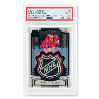 View full screen - View 1 of Lot 56. Alex Ovechkin Washington Capitals 2024-2025 Upper Deck The Cup Autograph-Black Foil Shield - PSA 7 Auto 10 | 1 of 1 | Signed and Inscribed | Game-Used Patch.