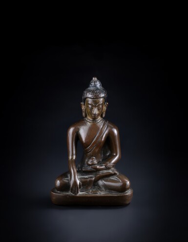 View full screen - View 1 of Lot 363. A small copper-alloy seated figure of Buddha, Nepal, 18th / 19th century.