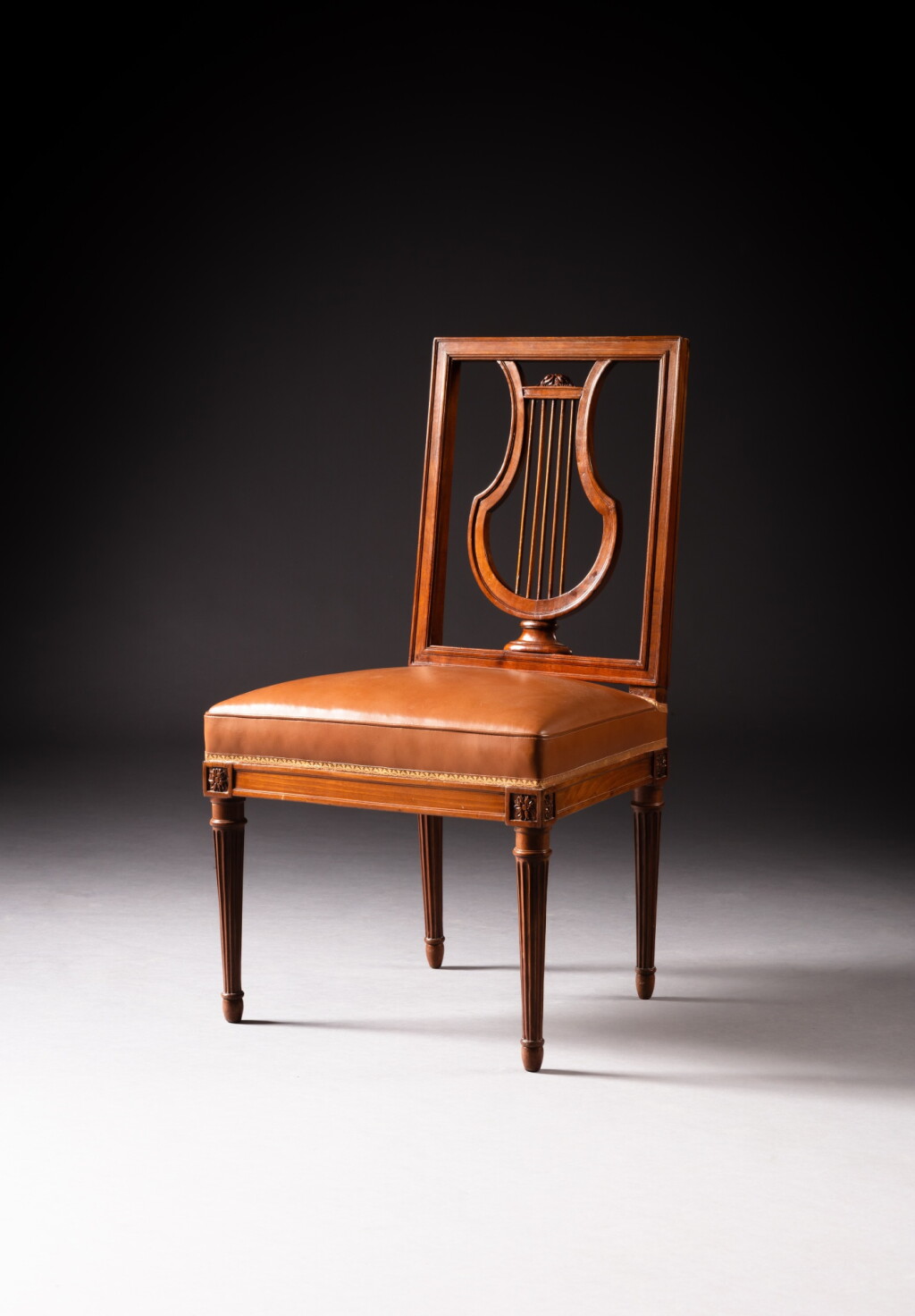 View full screen - View 1 of Lot 302. A set of six royal Louis XVI mahogany and mahogany venereed chairs, stamped by Jean-Baptiste Claude Sené | Suite de six chaises royales en acajou et placage d'acajou d'époque Louis XVI, estampille de Jean-Baptiste Claude Sené.