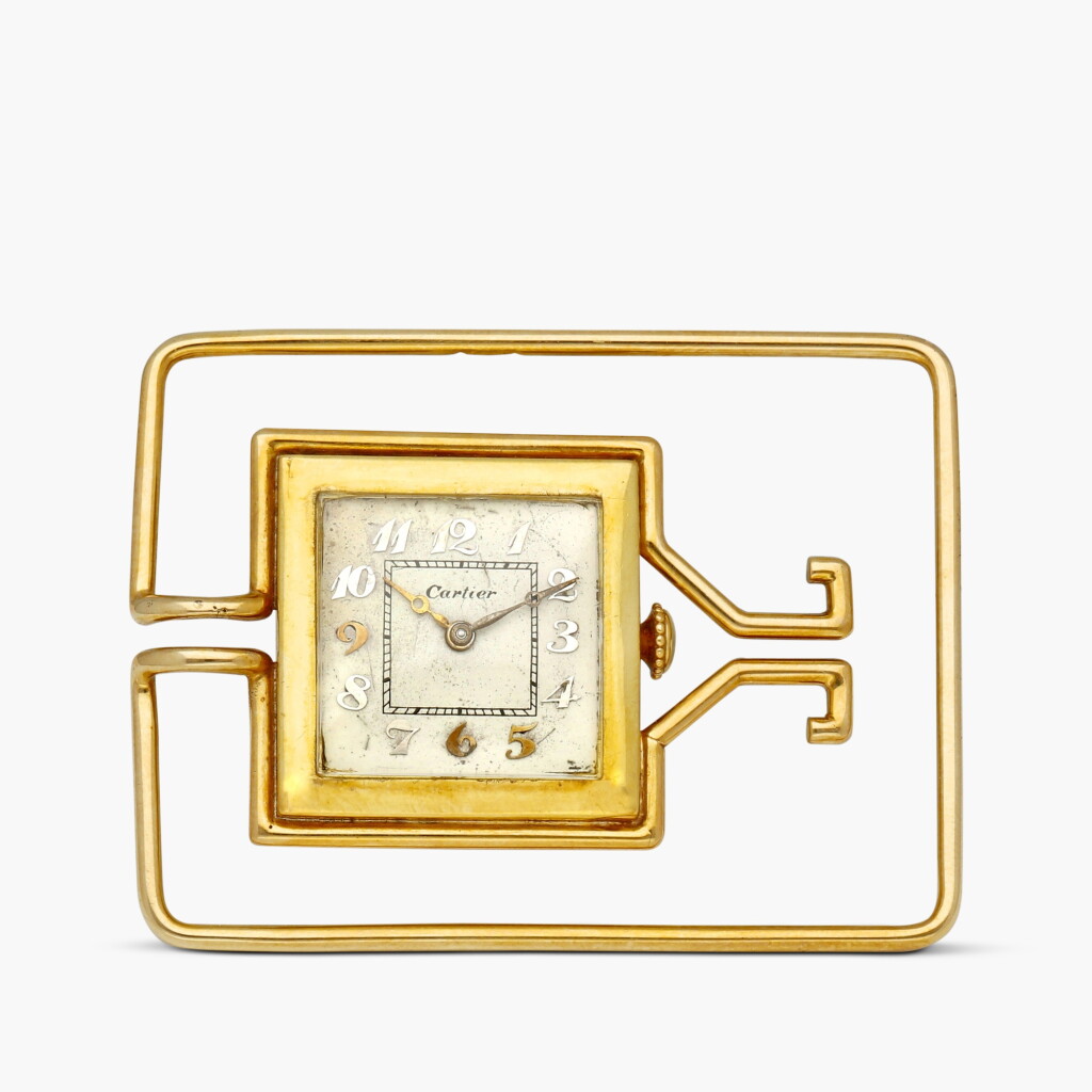 View full screen - View 1 of Lot 2147. New York retailed | A yellow gold square watch mounted within a money clip, Circa 1930.