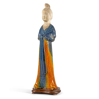 View full screen - View 1 of Lot 224. A rare and beautifully modelled blue and amber-glazed pottery figure of a court lady Tang dynasty | 唐 三彩仕女陶俑.
