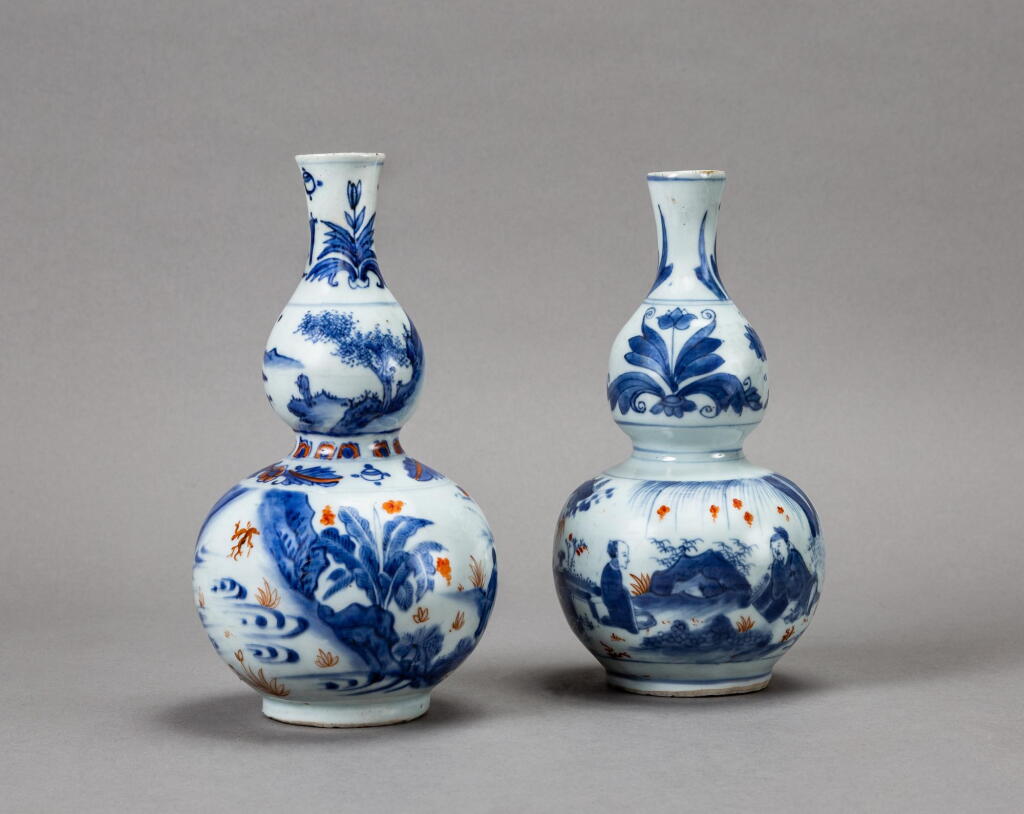 View full screen - View 1 of Lot 128. Two blue and white and iron red double gourd 'figural' vases, Qing dynasty, 17th century | 清十七世紀 青花礬紅彩人物故事紋葫蘆瓶兩件.
