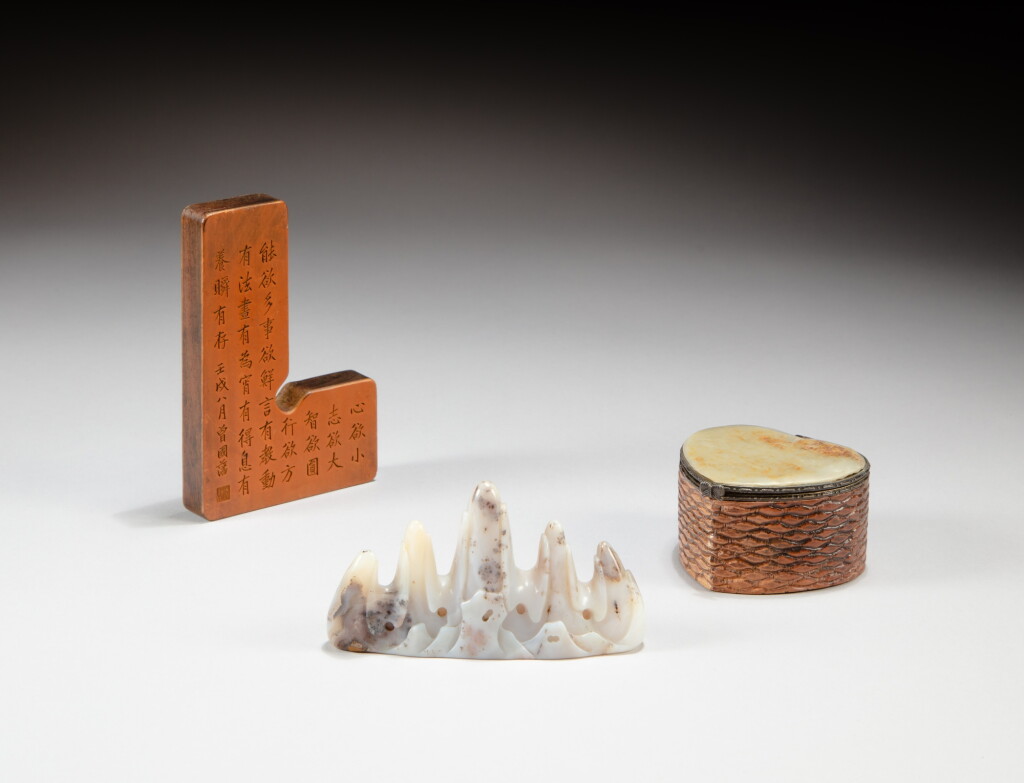 View full screen - View 1 of Lot 182. An agate mountain-shaped brushrest and an inscribed rules paperweight, Qing dynasty, and a jade plaque inlaid heart-shaped wood box, Qing dynasty, 19th - 20th century | 清 瑪瑙雕賞石筆山,雕詩鎮紙《曾國藩》款及清十九至二十世紀 木嵌玉心式盒一組三件.
