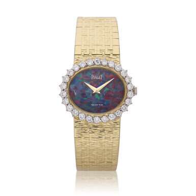 View full screen - View 1 of Lot 365. Reference 9326 | A yellow gold and diamond set bracelet watch with opal dial, Circa 1980.