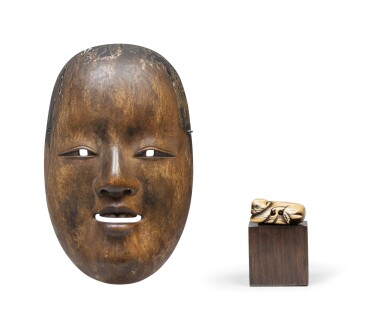View full screen - View 1 of Lot 40. Masque en bois de théâtre Nô, et netsuke d'un singe en ivoire sculpté Japon, époque Meiji A wood Noh mask, and an ivory netsuke of a monkey Japan, Meiji period.