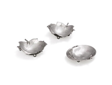 View full screen - View 1 of Lot 59. An Italian silver ashtray, signed Buccellati, 20th century and a pair of American silver ashtrays, signed Cartier, New York, 20th century.